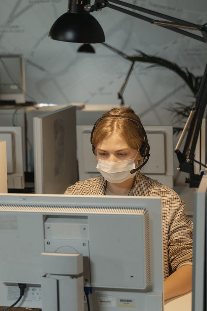 Woman in White and Black Checkered Dress Shirt Wearing White Face Mask